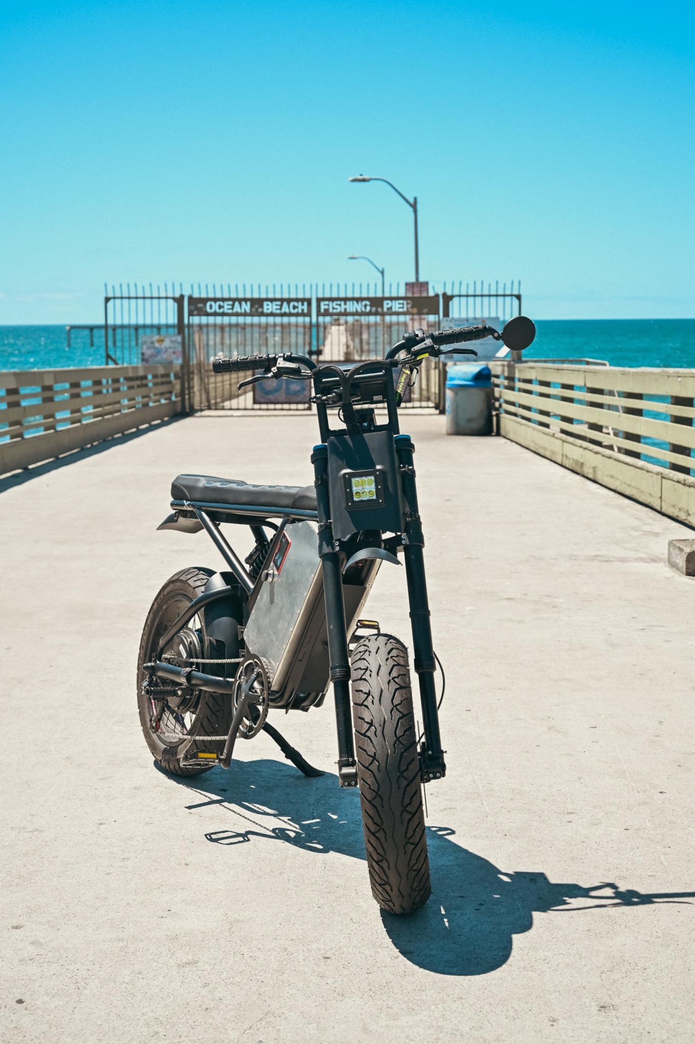 ZR Custom facing the camera at Ocean Beach Fishing Pier entrance, pier gate and Pacific Ocean behind