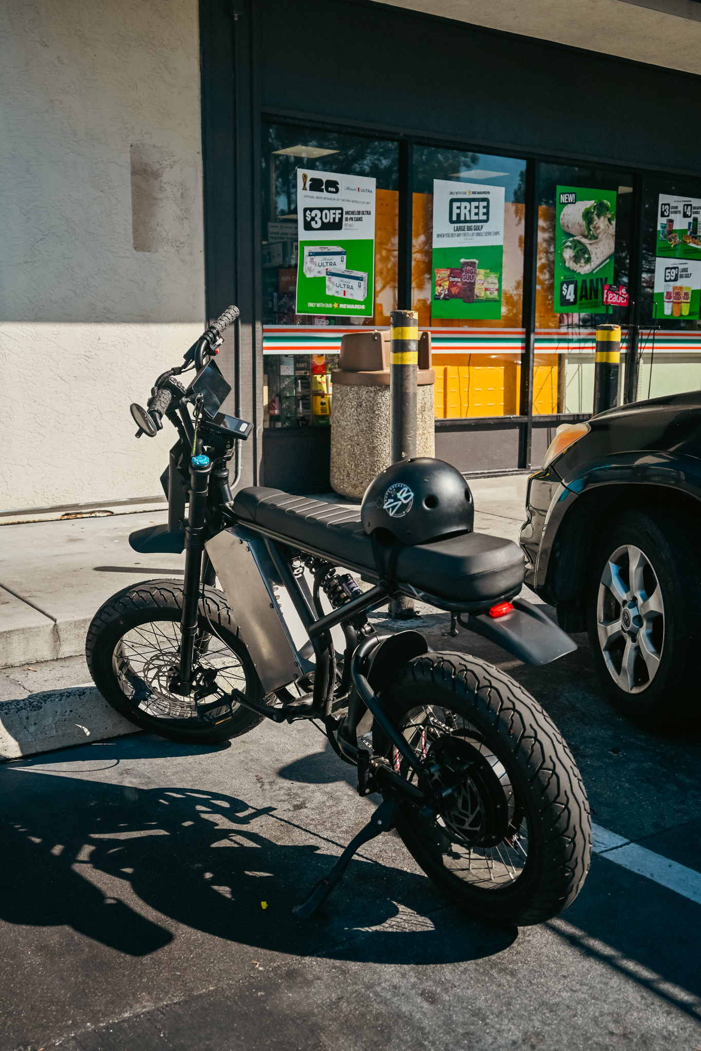 ZR Custom parked outside a 7-Eleven with black helmet resting on the seat