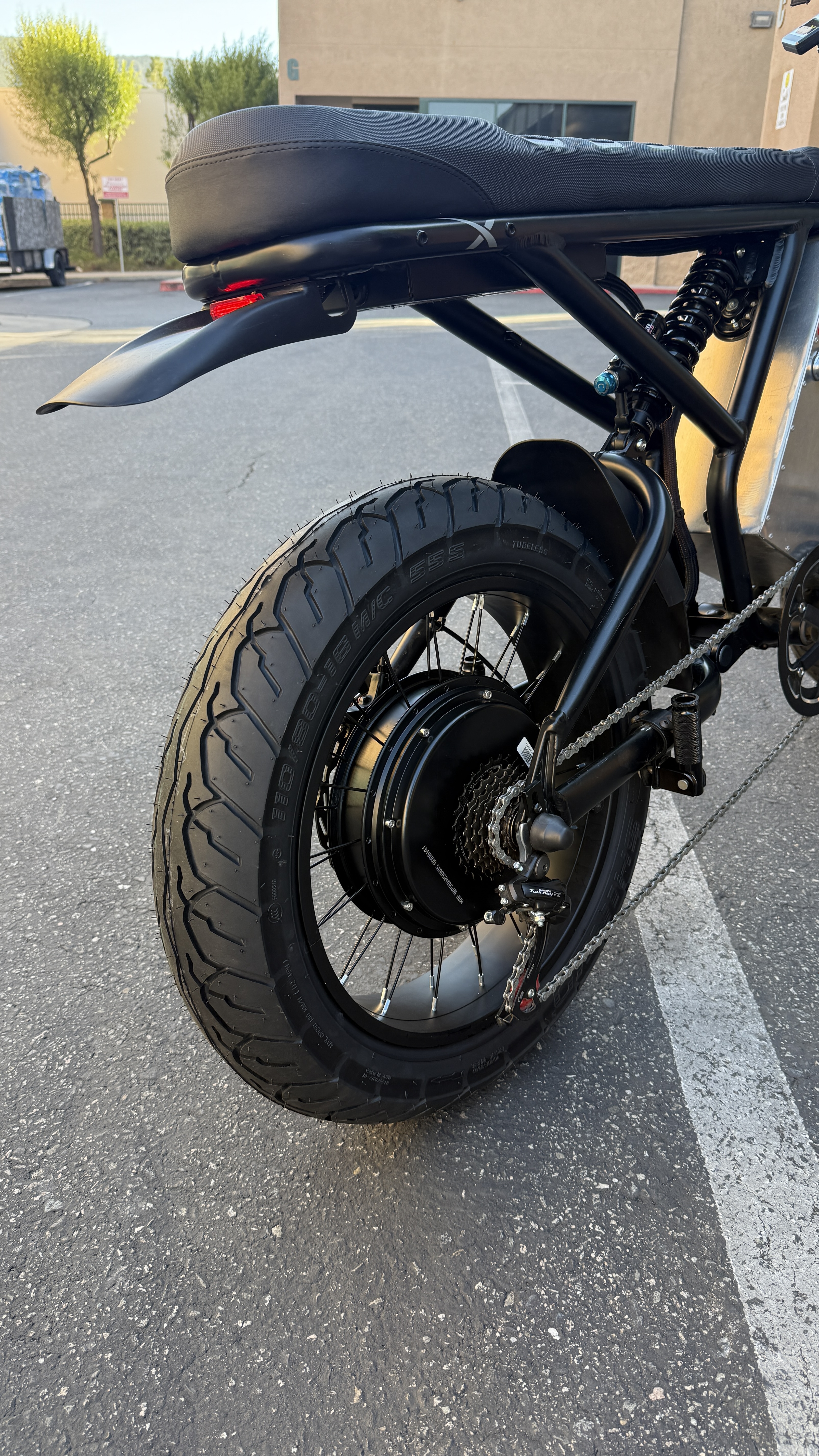 Rear wheel and hub motor installed with Shinko tire and DNM shock